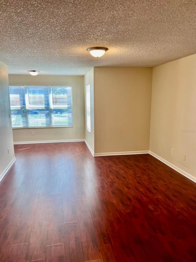 4606 Commander Dr Unit 1126, Orlando, FL 32822 - spare room with dark wood finished floors and a textured ceiling