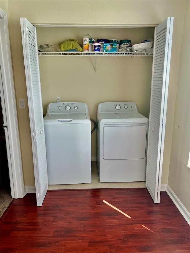 4606 Commander Dr Unit 1126, Orlando, FL 32822 - laundry room featuring separate washer and dryer and wood finished floors