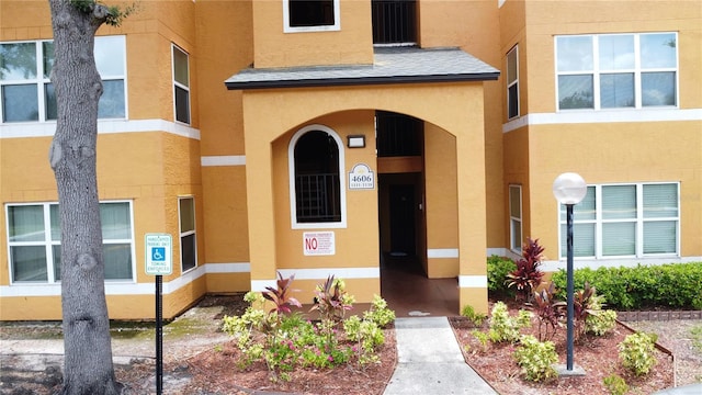 4606 Commander Dr Unit 1126, Orlando, FL 32822 - doorway to property with stucco siding
