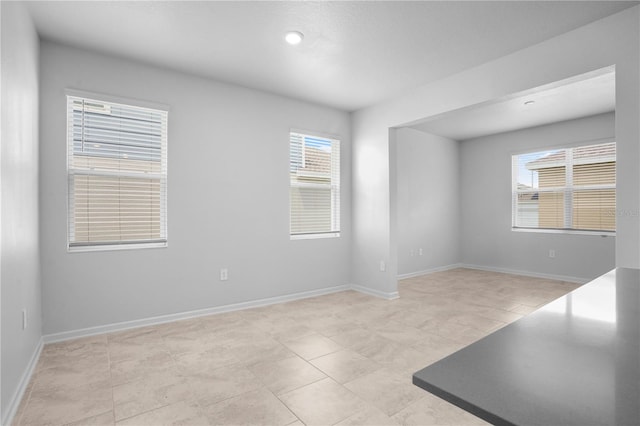 6449 Sprucepine Ln, Saint Cloud, FL 34771 - empty room with healthy amount of natural light and light tile patterned flooring