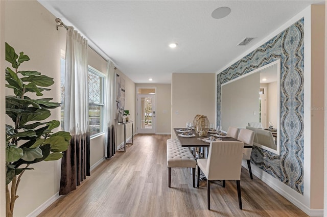 3349 Wynwood Forest Dr, Ocoee, FL 34761 - dining area featuring light wood-style flooring and recessed lighting