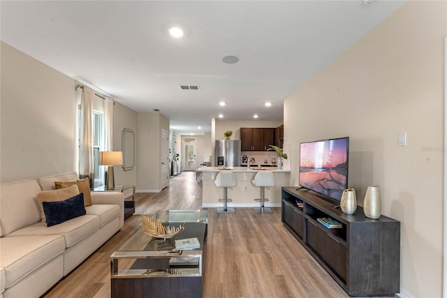 3349 Wynwood Forest Dr, Ocoee, FL 34761 - living room featuring light wood-type flooring and recessed lighting