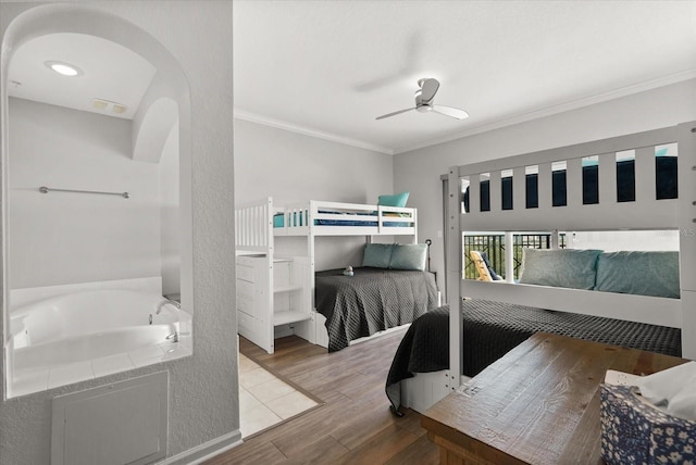 8101 Resort Village Dr Unit 31503, Orlando, FL 32821 - bedroom with wood finished floors, crown molding, arched walkways, and ceiling fan