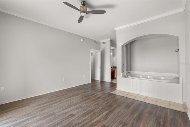 8101 Resort Village Dr Unit 31503, Orlando, FL 32821 - empty room with a ceiling fan, ornamental molding, wood finished floors, and arched walkways
