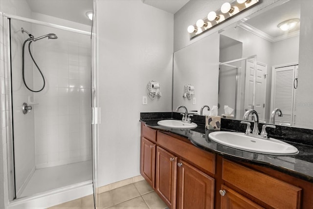 8101 Resort Village Dr Unit 31503, Orlando, FL 32821 - full bathroom with crown molding, tile patterned flooring, a stall shower, and double vanity