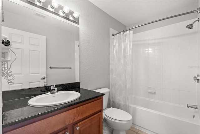 8101 Resort Village Dr Unit 31503, Orlando, FL 32821 - bathroom featuring a textured wall, shower / bath combo, vanity, and tile patterned flooring