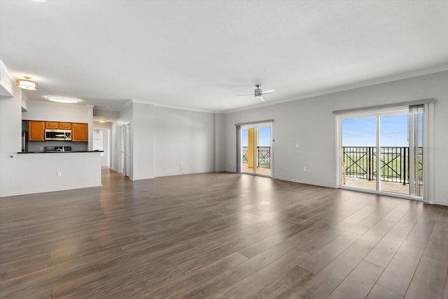 8101 Resort Village Dr Unit 31503, Orlando, FL 32821 - unfurnished living room featuring crown molding, a ceiling fan, and dark wood-type flooring