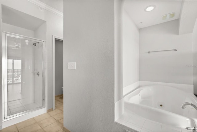 8101 Resort Village Dr Unit 31503, Orlando, FL 32821 - bathroom with a stall shower, a whirlpool tub, and tile patterned flooring