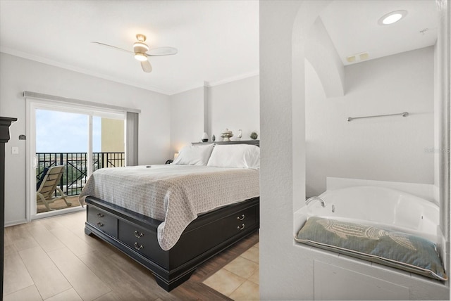 8101 Resort Village Dr Unit 31503, Orlando, FL 32821 - bedroom with access to exterior, crown molding, a ceiling fan, and wood finished floors