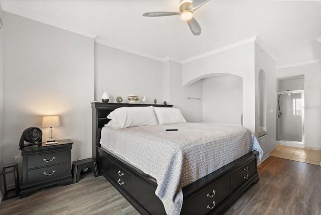 8101 Resort Village Dr Unit 31503, Orlando, FL 32821 - bedroom featuring crown molding, wood finished floors, a ceiling fan, and arched walkways