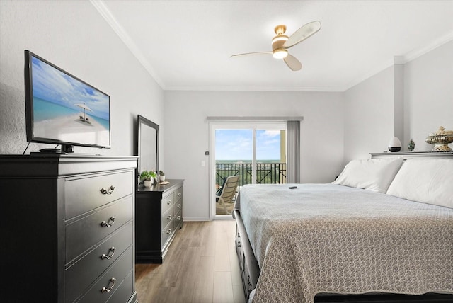 8101 Resort Village Dr Unit 31503, Orlando, FL 32821 - bedroom featuring access to outside, light wood finished floors, crown molding, and a ceiling fan