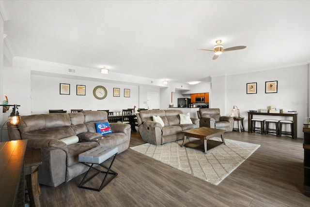 8101 Resort Village Dr Unit 31503, Orlando, FL 32821 - living room with ceiling fan, crown molding, and dark wood-style floors