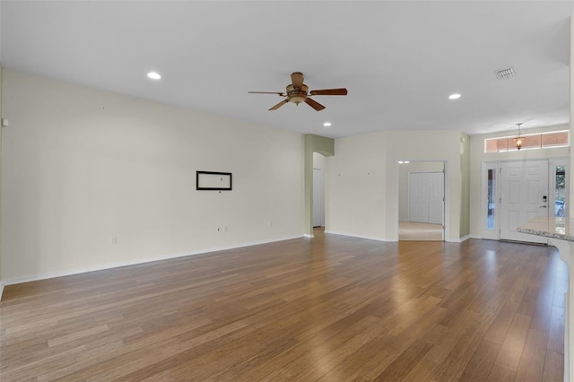 3533 Somerset Cir, Kissimmee, FL 34746 - unfurnished living room featuring wood finished floors, a ceiling fan, and recessed lighting