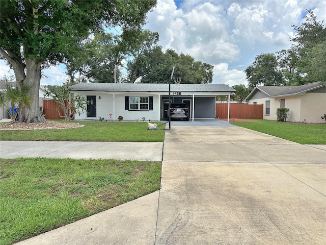 1428 Glendale St, Lakeland, FL 33803 - ranch-style home with driveway, a carport, and stucco siding
