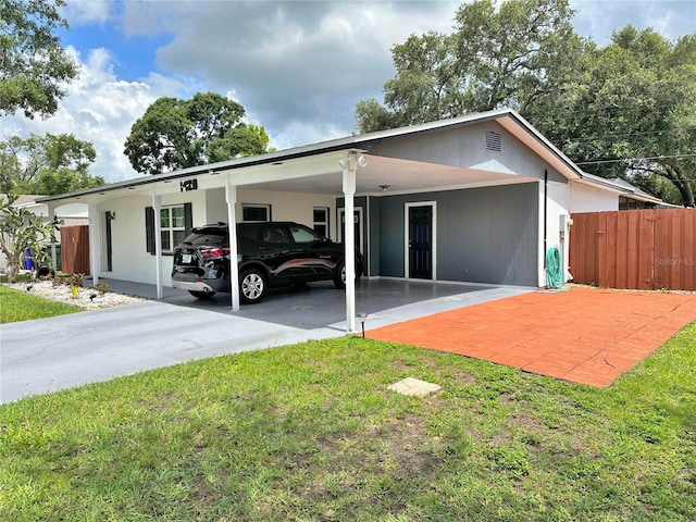 1428 Glendale St, Lakeland, FL 33803 - view of front of property with concrete driveway and a carport