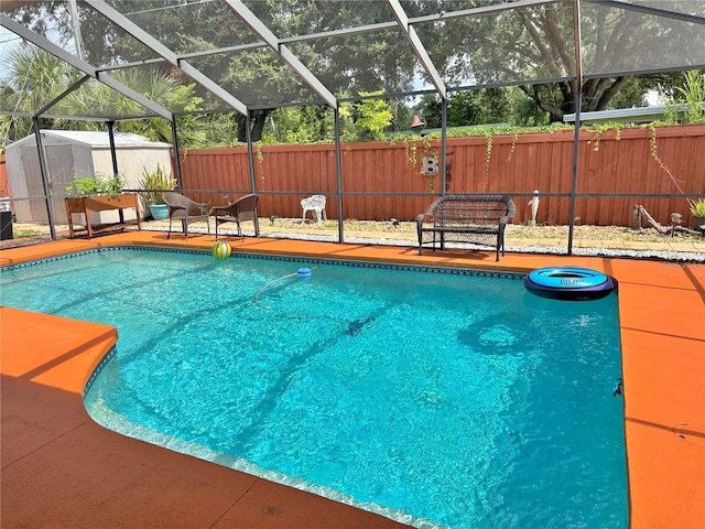 1428 Glendale St, Lakeland, FL 33803 - view of pool with a fenced backyard, a storage shed, glass enclosure, and a patio area