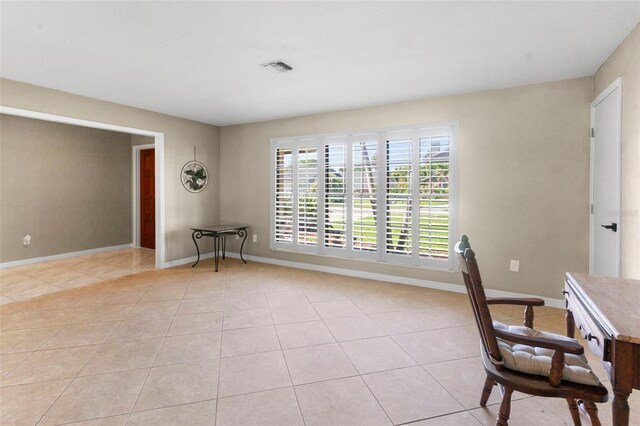 2113 Lochmoor Cir, North Fort Myers, FL 33903 - unfurnished office with light tile patterned flooring and baseboards