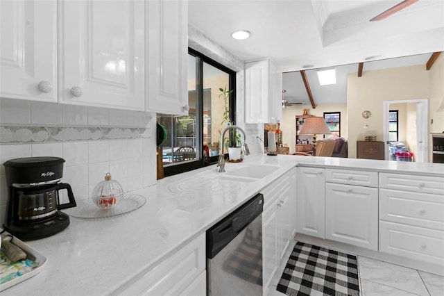 2113 Lochmoor Cir, North Fort Myers, FL 33903 - kitchen featuring dishwasher, ceiling fan, tasteful backsplash, white cabinetry, and a peninsula