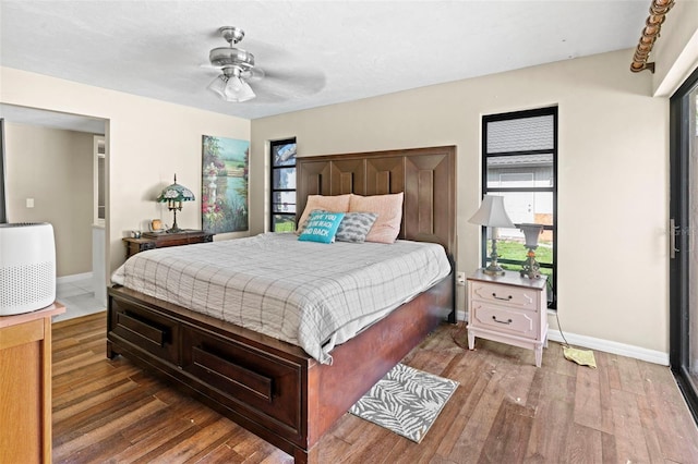 2113 Lochmoor Cir, North Fort Myers, FL 33903 - bedroom featuring wood-type flooring and a ceiling fan