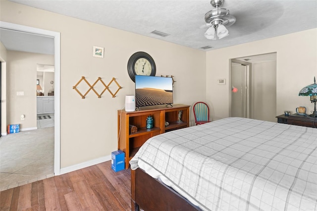 2113 Lochmoor Cir, North Fort Myers, FL 33903 - bedroom featuring wood finished floors and a ceiling fan