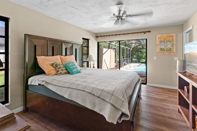2113 Lochmoor Cir, North Fort Myers, FL 33903 - bedroom featuring access to outside, hardwood / wood-style flooring, a textured ceiling, and a ceiling fan