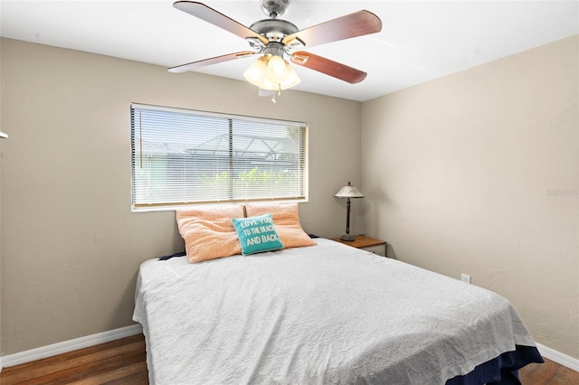2113 Lochmoor Cir, North Fort Myers, FL 33903 - bedroom featuring wood finished floors and a ceiling fan