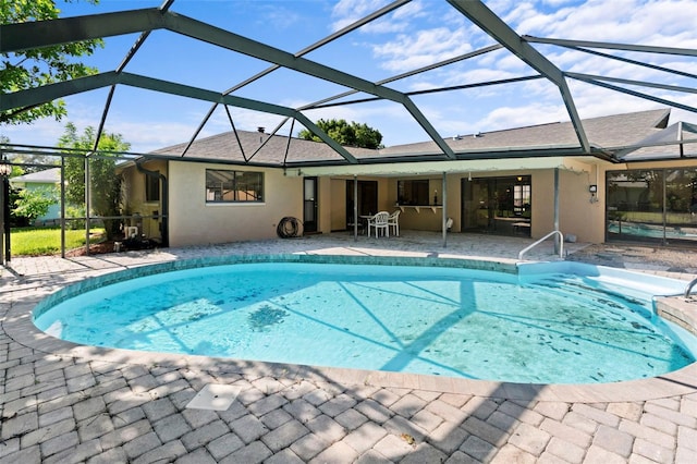 2113 Lochmoor Cir, North Fort Myers, FL 33903 - outdoor pool with a patio and glass enclosure