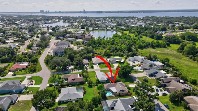 2113 Lochmoor Cir, North Fort Myers, FL 33903 - aerial view of property and surrounding area featuring nearby suburban area and a large body of water