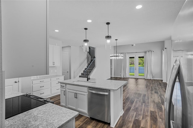 840 Livestock Loop, Saint Cloud, FL 34771 - kitchen featuring dishwasher, white cabinets, an island with sink, range, and recessed lighting