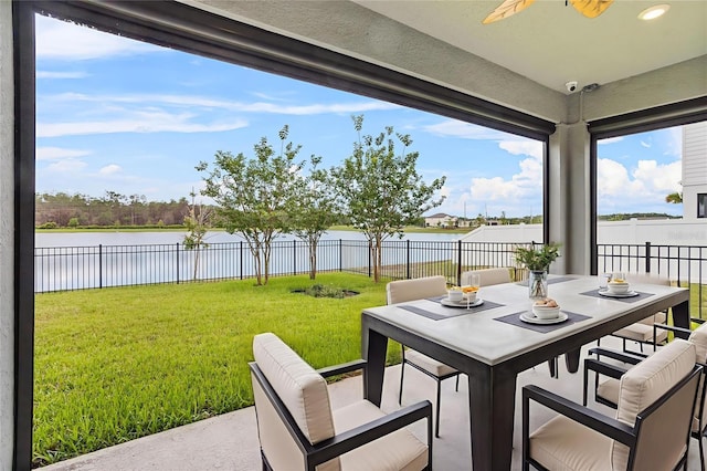 840 Livestock Loop, Saint Cloud, FL 34771 - fenced backyard featuring a water view, ceiling fan, outdoor dining area, and a patio