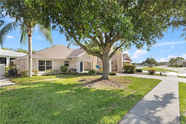 16602 Citrus Pkwy, Clermont, FL 34714 - view of front facade with a front lawn and stucco siding