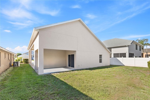 16602 Citrus Pkwy, Clermont, FL 34714 - rear view of house featuring stucco siding and a patio