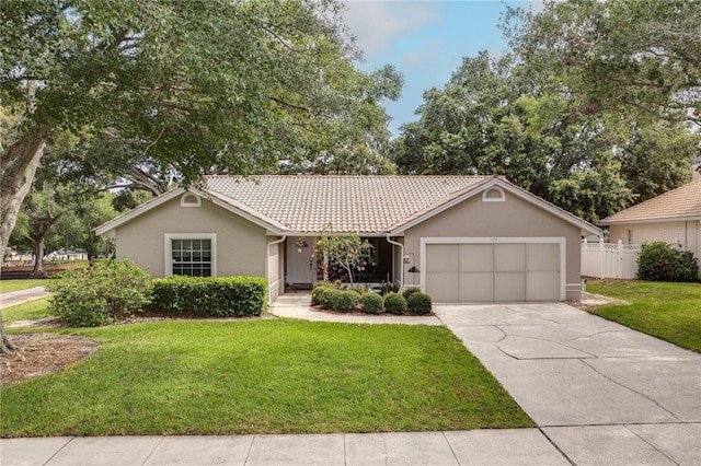 1073 Sadie Ln, Winter Garden, FL 34787 - ranch-style house featuring a garage, stucco siding, a tile roof, and concrete driveway