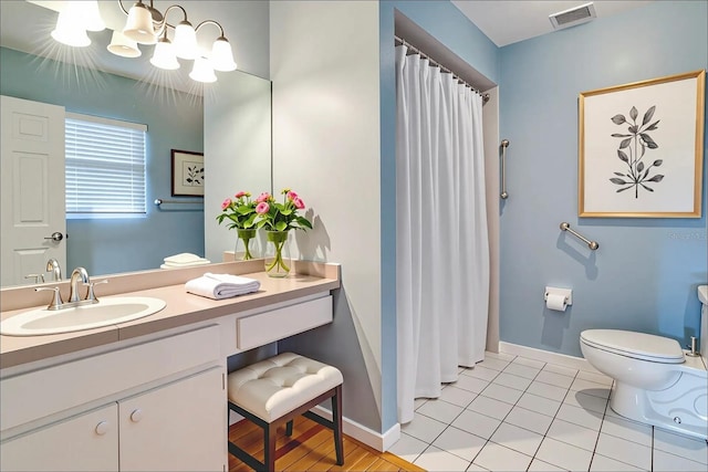 1073 Sadie Ln, Winter Garden, FL 34787 - full bathroom featuring vanity, a chandelier, a shower with curtain, and tile patterned floors