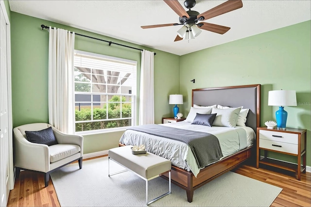 1073 Sadie Ln, Winter Garden, FL 34787 - bedroom with wood finished floors and a ceiling fan