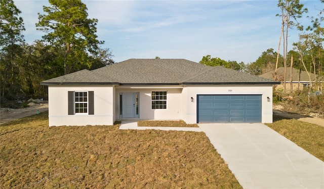 709 Marion Oaks Mnr, Ocala, FL 34473 - view of front of house featuring a garage, stucco siding, driveway, roof with shingles, and a front lawn