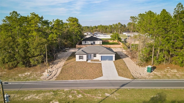 709 Marion Oaks Mnr, Ocala, FL 34473 - view of subject property with a tree filled landscape