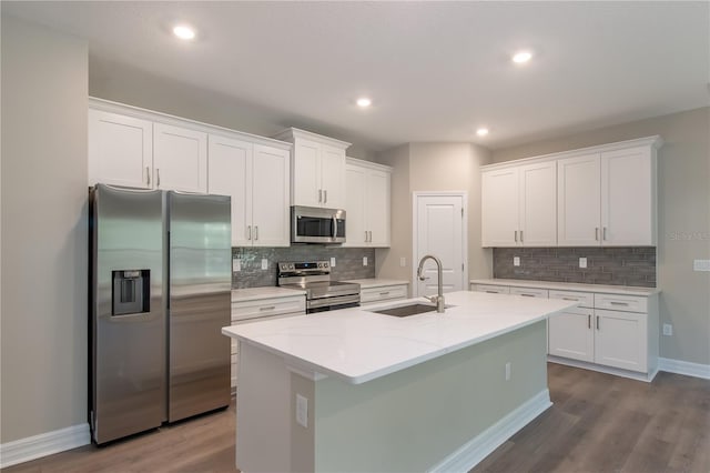 2833 E Newhaven St, Inverness, FL 34453 - kitchen with appliances with stainless steel finishes, white cabinets, tasteful backsplash, dark wood-type flooring, and recessed lighting