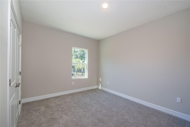 2833 E Newhaven St, Inverness, FL 34453 - unfurnished bedroom featuring carpet floors and baseboards