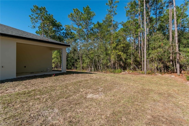 2833 E Newhaven St, Inverness, FL 34453 - view of green lawn with a patio area