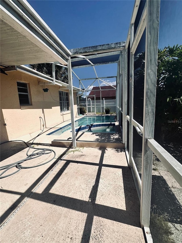 5265 Broken Arrow Dr, Kissimmee, FL 34746 - unfurnished sunroom featuring a swimming pool