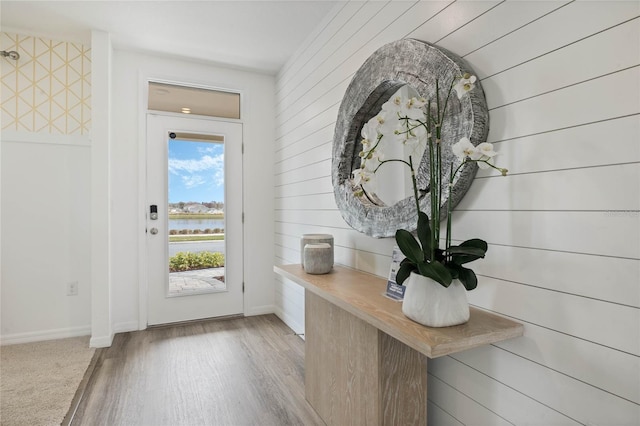 3413 Wynwood Forest Dr, Ocoee, FL 34761 - foyer featuring a water view, wood finished floors, and wood walls