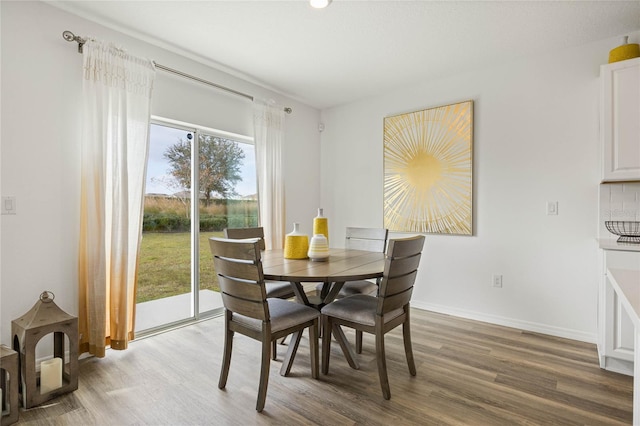 3413 Wynwood Forest Dr, Ocoee, FL 34761 - dining area with wood finished floors and recessed lighting