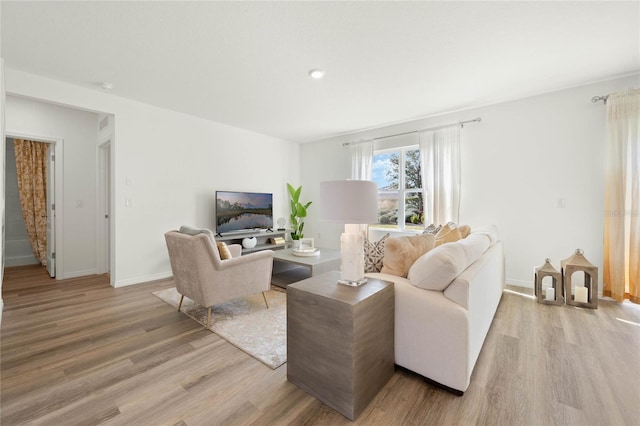 3413 Wynwood Forest Dr, Ocoee, FL 34761 - living area with light wood-style floors and recessed lighting