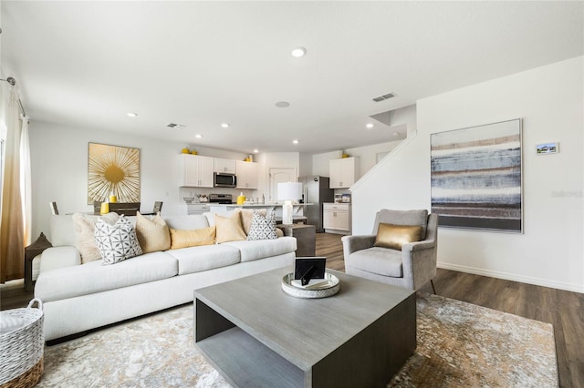 3413 Wynwood Forest Dr, Ocoee, FL 34761 - living room with dark wood finished floors and recessed lighting