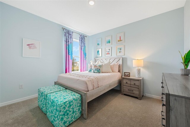 3413 Wynwood Forest Dr, Ocoee, FL 34761 - bedroom featuring light carpet and baseboards