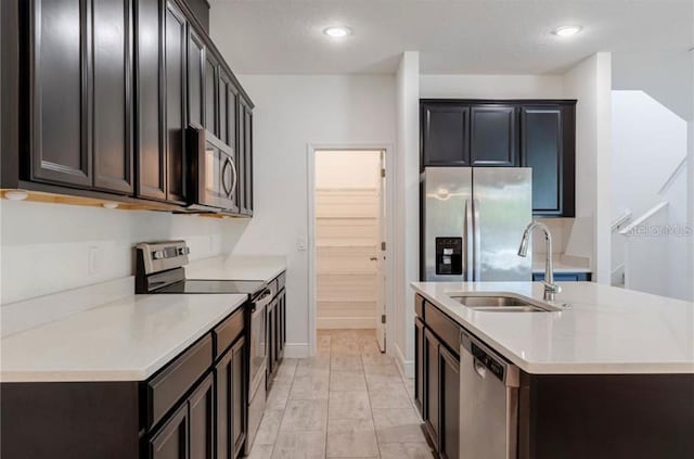 14007 Picard Aly, Winter Garden, FL 34787 - kitchen featuring stainless steel appliances, a center island with sink, light countertops, and recessed lighting