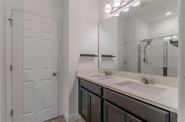 14007 Picard Aly, Winter Garden, FL 34787 - full bathroom with double vanity and a shower stall