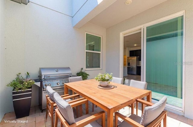 14007 Picard Aly, Winter Garden, FL 34787 - view of patio / terrace featuring outdoor dining space and grilling area