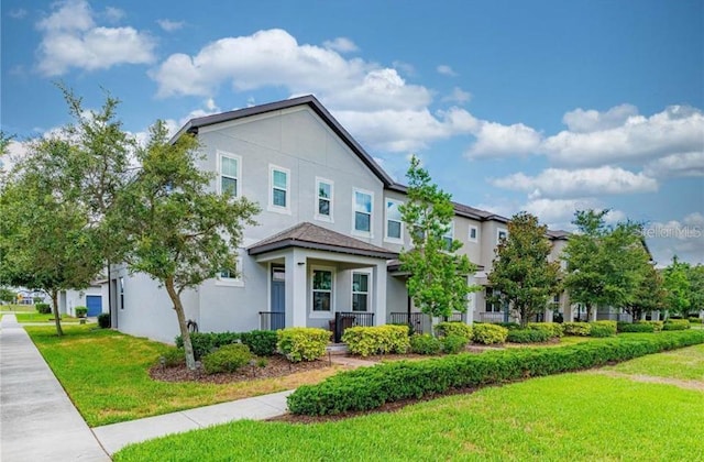 14007 Picard Aly, Winter Garden, FL 34787 - view of front of home with stucco siding and a front yard